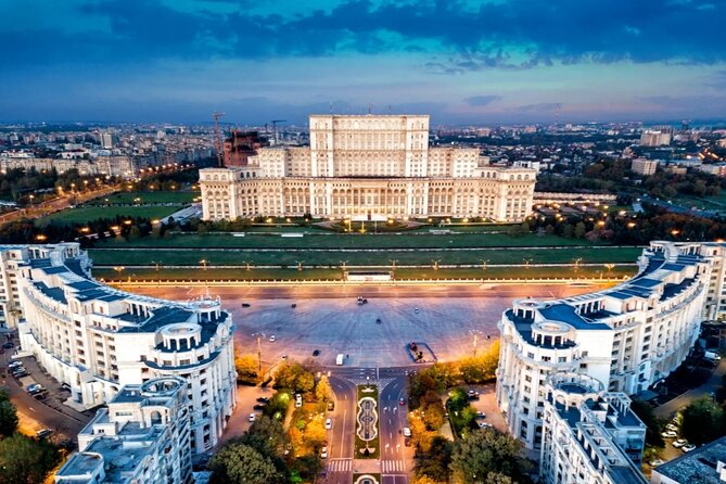 The Palace of the Parliament and the boulevard below it, lit at dusk