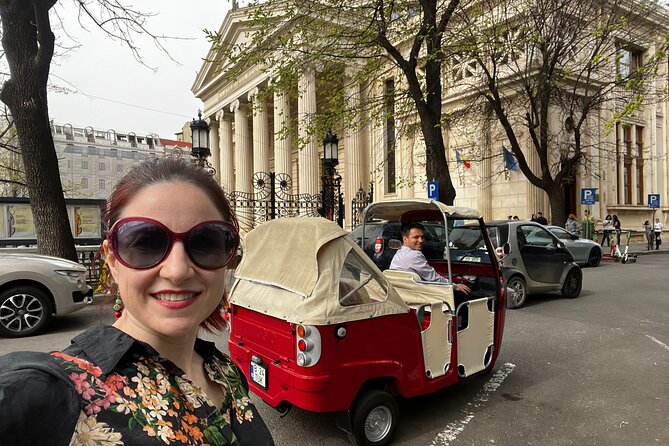 Bucharest Tuk Tuk city tour - The House of the Free Press shows the communist city