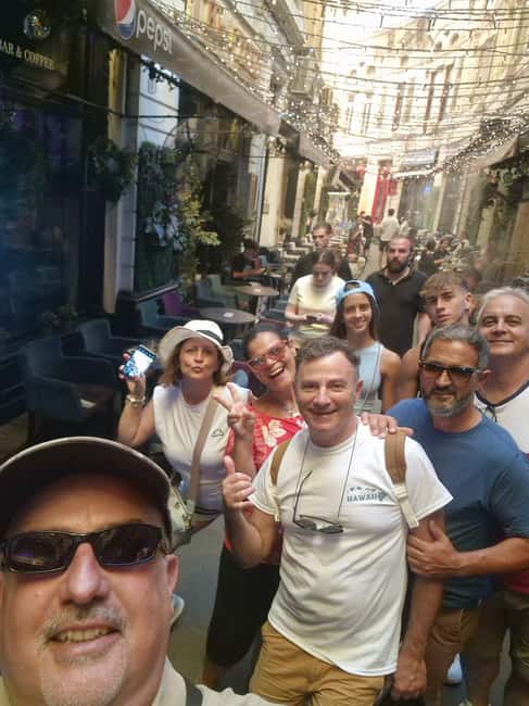 Bucharest: Walking tour with Italian speaking guide for small groups - Cărturești Carusel and the commercial heart of Bucharest