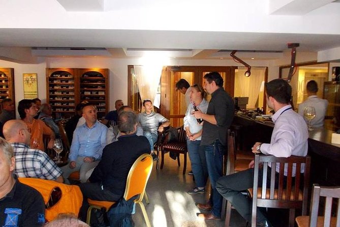Traditions in Bucharest: Village Museum and Wine Tasting Tour - Romanian wine, three glasses, and a plate of local food